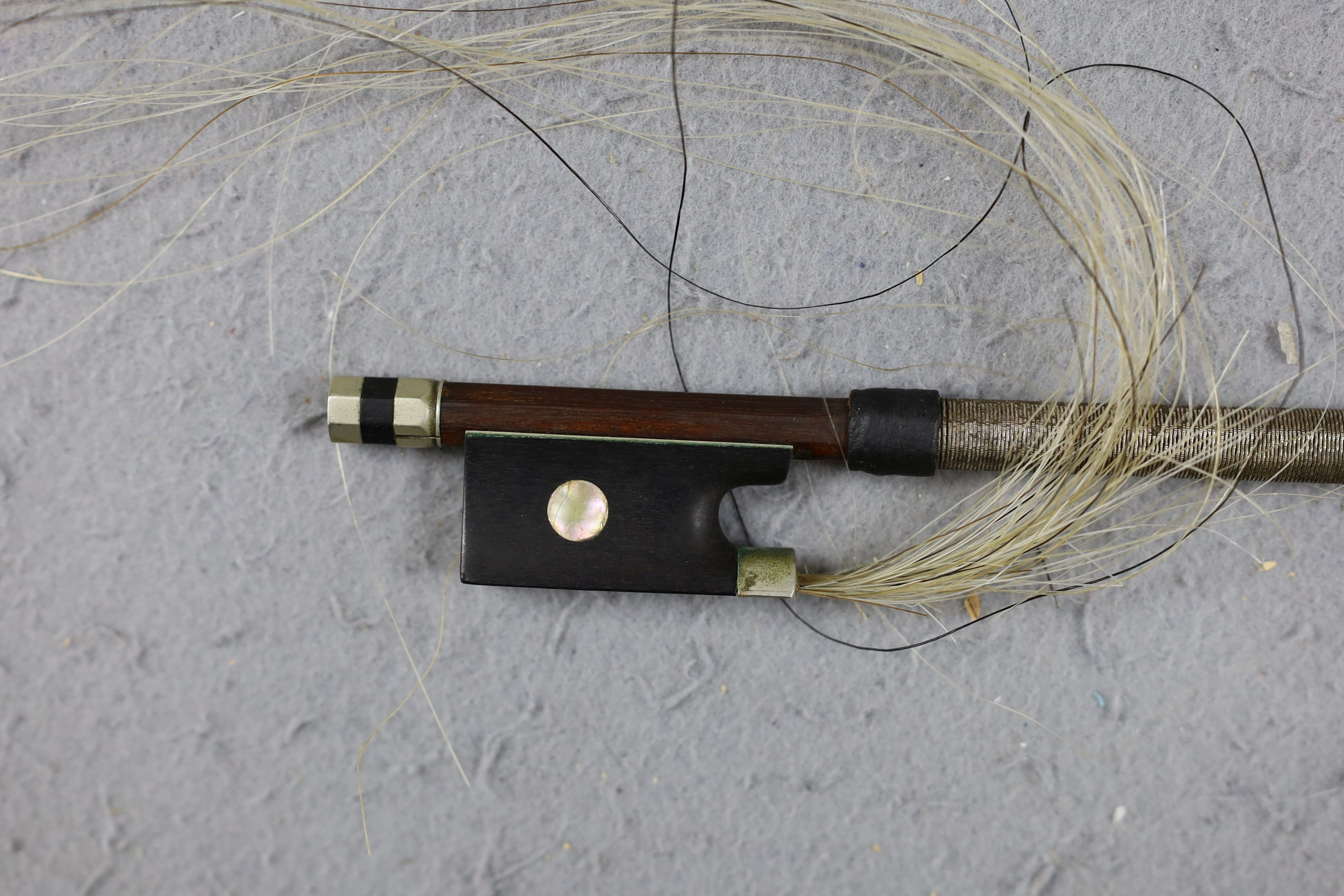 A cased 19th century violin, labelled Stradivarius 1690, with a Dodd bow